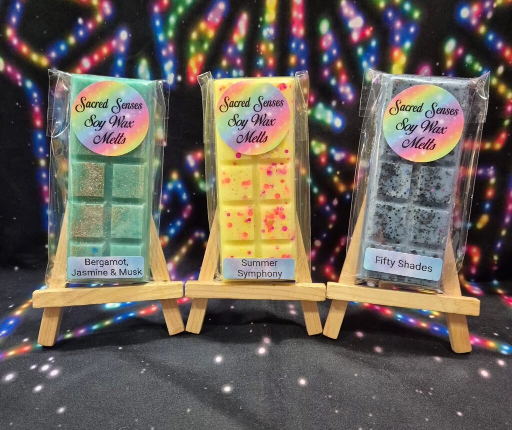 Handmade wax melt snap bars with biodegradable glitter and vibrant colour, photographed in natural light