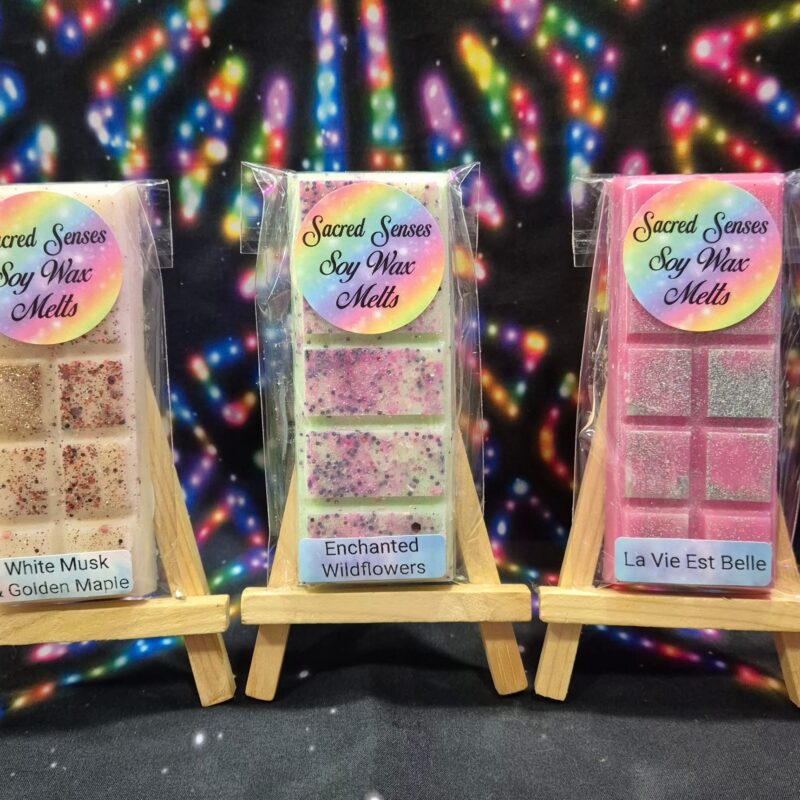 Expertly hand-poured wax melts made with eco soy wax and biodegradable glitter, displayed in-store at Sacred Senses.